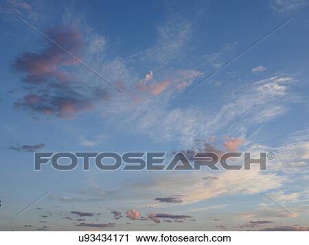 Moody clouds in sky View Large Photo Image Stock Image - Moody clouds in sky. Fotosearch