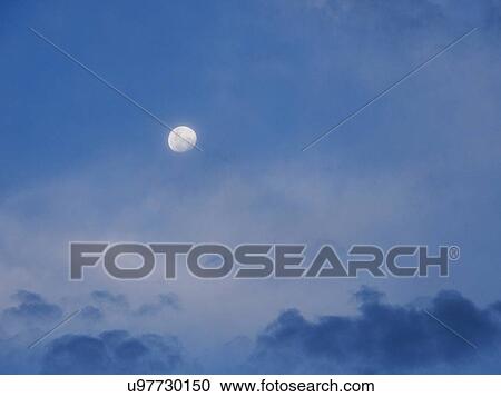 Moon in blue sky View Large Photo Image Stock Image - Moon in blue sky. Fotosearch