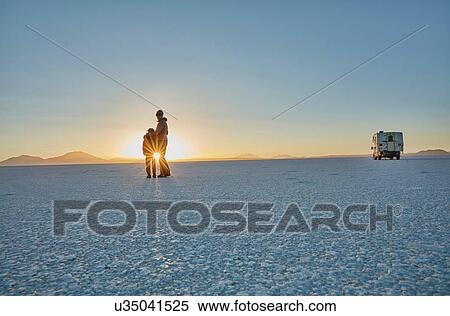 Mother and son standing on salt flats, looking at view, Salar de Uyuni, Uyuni, Oruro, Bolivia, South America View Large Photo Image Stock Photography - Mother and son standing on salt flats, looking at view, Salar de Uyuni, Uyuni, Oruro, Bolivia, South America. Fotosearch