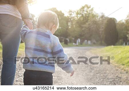 Picture - Mother and son taking walk. Fotosearch