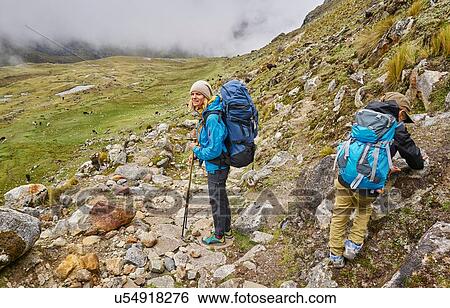 Stock Photograph - Mother and son, trekking through landscape, Ventilla, La Paz, Bolivia, South America. Fotosearch