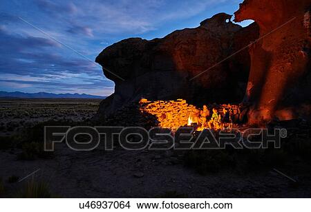 Mother and sons, sitting beside camp fire at dusk, Oruro, Oruro, Bolivia, South America View Large Photo Image Picture - Mother and sons, sitting beside camp fire at dusk, Oruro, Oruro, Bolivia, South America. Fotosearch