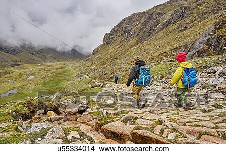 Picture - Mother and sons, trekking through landscape, Ventilla, La Paz, Bolivia, South America. Fotosearch