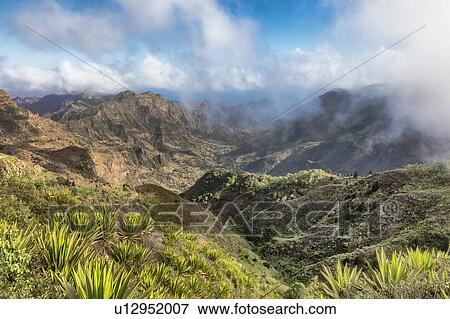Mountain landscape with low clouds, Serra da Malagueta, Santiago, Cape Verde, Africa View Large Photo Image Stock Photo - Mountain landscape with low clouds, Serra da Malagueta, Santiago, Cape Verde, Africa. Fotosearch