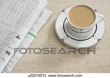 Newspaper and coffee on table View Large Photo Image Stock Photography - Newspaper and coffee on table. Fotosearch