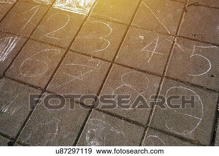 Stock Photo - Numbers on pavement.. Fotosearch