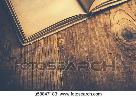 Old book on library desk. View Large Photo Image Stock Image - Old book on library desk.. Fotosearch