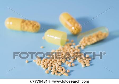 Open dietary supplement capsule. View Large Photo Image Picture - Open dietary supplement capsule.. Fotosearch