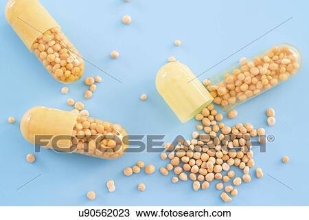 Stock Image - Open dietary supplement capsule.. Fotosearch
