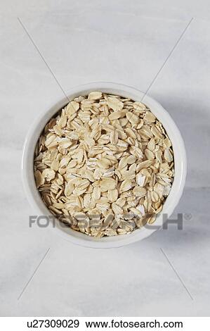 Overhead view of oats in bowl View Large Photo Image Stock Photo - Overhead view of oats in bowl. Fotosearch