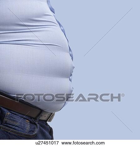 Overweight man wearing blue shirt, side view. View Large Photo Image Stock Photo - Overweight man wearing blue shirt, side view.. Fotosearch