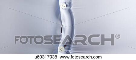 Overweight man wearing blue shirt with bulging buttons. View Large Photo Image Stock Photo - Overweight man wearing blue shirt with bulging buttons.. Fotosearch