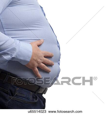 Stock Image - Overweight man with hands on his stomach, side view.. Fotosearch