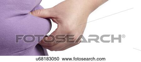 Overweight woman holding the fat around her waist. View Large Photo Image Stock Image - Overweight woman holding the fat around her waist.. Fotosearch