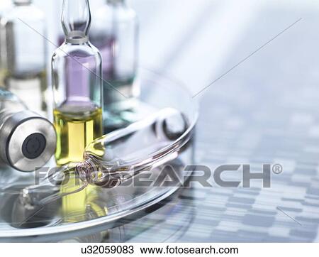 Stock Image - Personalised medicine, conceptual image. Variety of drugs sitting on a DNA (deoxyribonucleic acid) autoradiogram.. Fotosearch
