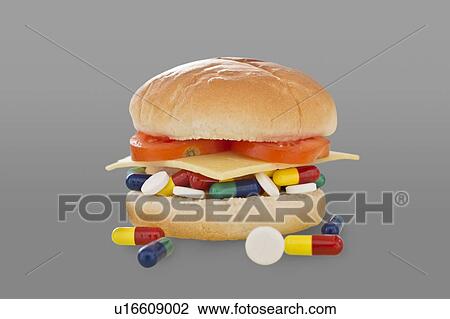 Pills in a burger, conceptual image of antibiotics in food. View Large Photo Image Stock Image - Pills in a burger, conceptual image of antibiotics in food.. Fotosearch
