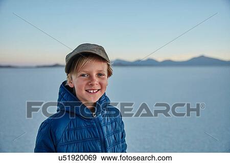 Portrait of boy on salt flats, Salar de Uyuni, Uyuni, Oruro, Bolivia, South America View Large Photo Image Stock Photo - Portrait of boy on salt flats, Salar de Uyuni, Uyuni, Oruro, Bolivia, South America. Fotosearch
