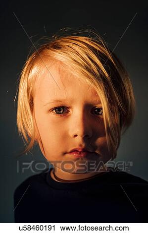 Portrait of boy with blonde hair, pensive expression View Large Photo Image Stock Image - Portrait of boy with blonde hair, pensive expression. Fotosearch