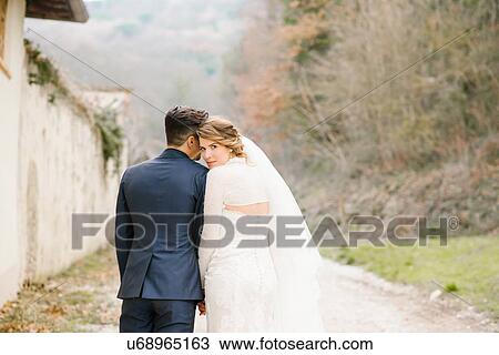Portrait of bride and bridegroom on country lane View Large Photo Image Stock Image - Portrait of bride and bridegroom on country lane. Fotosearch