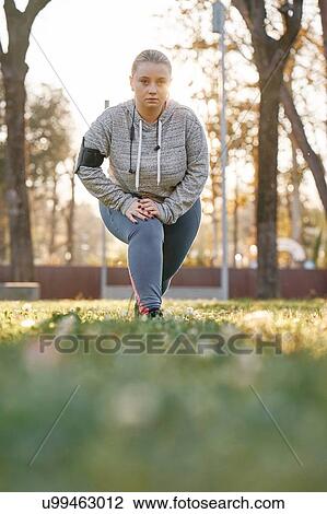 Portrait of curvaceous young woman training in park, leaning forward and crouching View Large Photo Image Stock Image - Portrait of curvaceous young woman training in park, leaning forward and crouching. Fotosearch