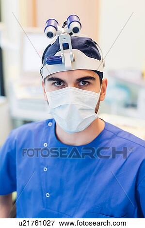 Portrait of dentist wearing magnifying loupes View Large Photo Image Stock Photo - Portrait of dentist wearing magnifying loupes. Fotosearch