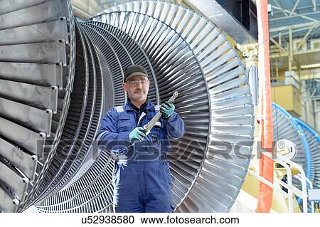 Portrait of engineer with turbine blade in turbine maintenance factory View Large Photo Image Stock Image - Portrait of engineer with turbine blade in turbine maintenance factory. Fotosearch