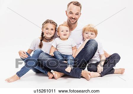 Stock Image - Portrait of father with daughter and sons. Fotosearch