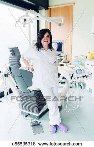 Stock Photo - Portrait of female dentist in dentist office. Fotosearch