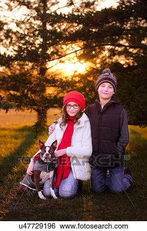 Portrait of girl and boy, with boston terrier dog, outdoors View Large Photo Image Stock Photograph - Portrait of girl and boy, with boston terrier dog, outdoors. Fotosearch