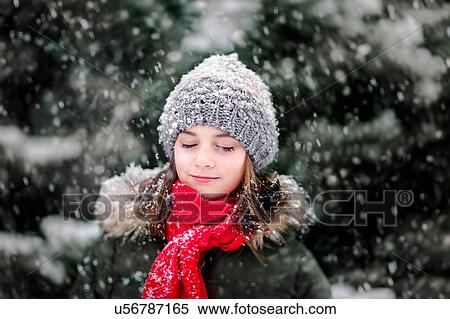 Portrait of girl in falling snow View Large Photo Image Stock Photography - Portrait of girl in falling snow. Fotosearch