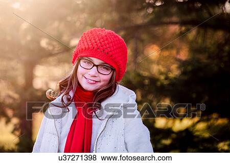 Stock Photo - Portrait of girl, outdoors, smiling. Fotosearch