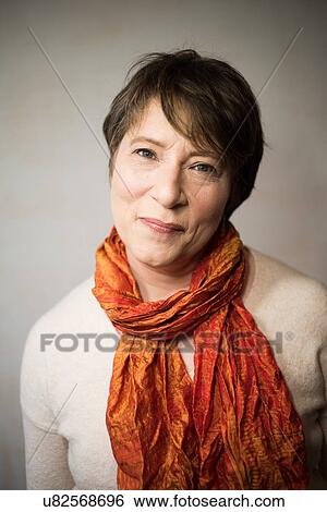 Stock Photograph - Portrait of happy and confident woman. Fotosearch
