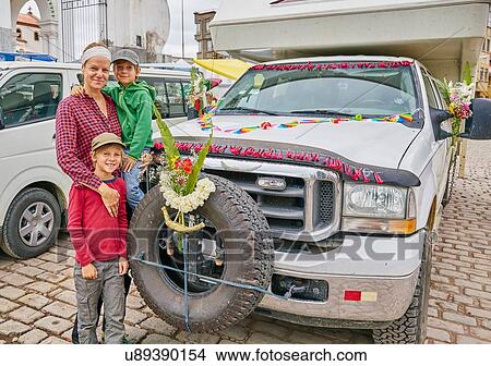 Portrait of mother and sons beside recreational vehicle, Copacabana, Oruro, Bolivia, South America View Large Photo Image Picture - Portrait of mother and sons beside recreational vehicle, Copacabana, Oruro, Bolivia, South America. Fotosearch