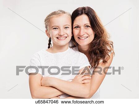 Stock Photograph - Portrait of mother with daughter. Fotosearch