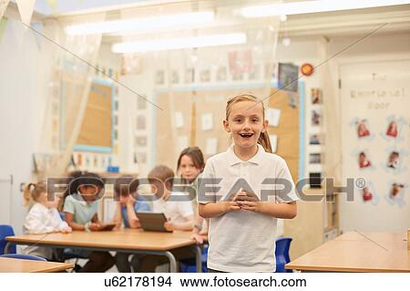 Portrait of schoolgirl in classroom lesson at primary school View Large Photo Image Picture - Portrait of schoolgirl in classroom lesson at primary school. Fotosearch