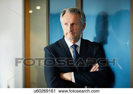 Portrait of senior businessman with arms folded View Large Photo Image Stock Image - Portrait of senior businessman with arms folded. Fotosearch