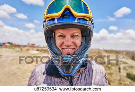 Portrait of woman wearing crash helmet, close-up, La Paz, Bolivia, South America View Large Photo Image Picture - Portrait of woman wearing crash helmet, close-up, La Paz, Bolivia, South America. Fotosearch