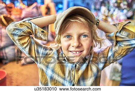 Stock Image - Portrait of young boy at festival, Sucre, Potosi, Bolivia, South America. Fotosearch