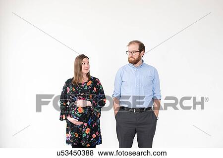 Pregnant couple, white background View Large Photo Image Stock Photo - Pregnant couple, white background. Fotosearch