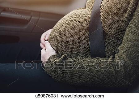 Pregnant woman wearing seat belt. View Large Photo Image Stock Image - Pregnant woman wearing seat belt.. Fotosearch
