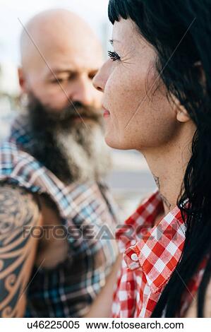 Stock Photography - Profile portrait of mature hipster woman with boyfriend. Fotosearch
