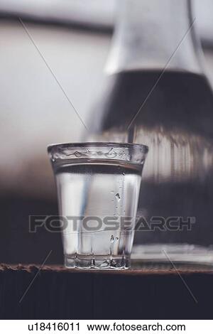 Rakia alcoholic drinking bottle with shot glass. View Large Photo Image Stock Image - Rakia alcoholic drinking bottle with shot glass.. Fotosearch
