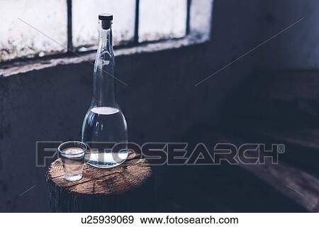 Rakia alcoholic drinking bottle with shot glass. View Large Photo Image Stock Photo - Rakia alcoholic drinking bottle with shot glass.. Fotosearch