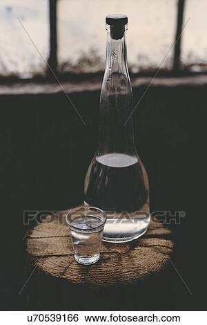 Rakia alcoholic drinking bottle with shot glass. View Large Photo Image Stock Photograph - Rakia alcoholic drinking bottle with shot glass.. Fotosearch