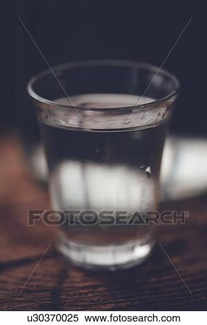 Rakia alcoholic drinking bottle with shot glass. View Large Photo Image Stock Photography - Rakia alcoholic drinking bottle with shot glass.. Fotosearch