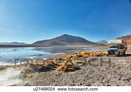 Recreational vehicle moving across landscape, Chalviri, Oruro, Bolivia, South America View Large Photo Image Picture - Recreational vehicle moving across landscape, Chalviri, Oruro, Bolivia, South America. Fotosearch