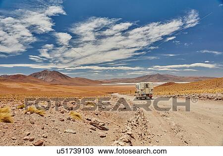 Recreational vehicle moving across landscape, rear view, Chalviri, Oruro, Bolivia, South America View Large Photo Image Stock Image - Recreational vehicle moving across landscape, rear view, Chalviri, Oruro, Bolivia, South America. Fotosearch