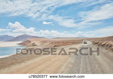 Stock Photo - Recreational vehicle on empty road, Chiguana, Potosi, Bolivia, South America. Fotosearch