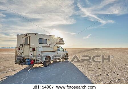 Stock Photo - Recreational vehicle, travelling across salt flats, Salar de Uyuni, Uyuni, Oruro, Bolivia, South America. Fotosearch