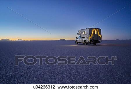 Recreational vehicle, travelling at dusk, across salt flats, Salar de Uyuni, Uyuni, Oruro, Bolivia, South America View Large Photo Image Stock Image - Recreational vehicle, travelling at dusk, across salt flats, Salar de Uyuni, Uyuni, Oruro, Bolivia, South America. Fotosearch